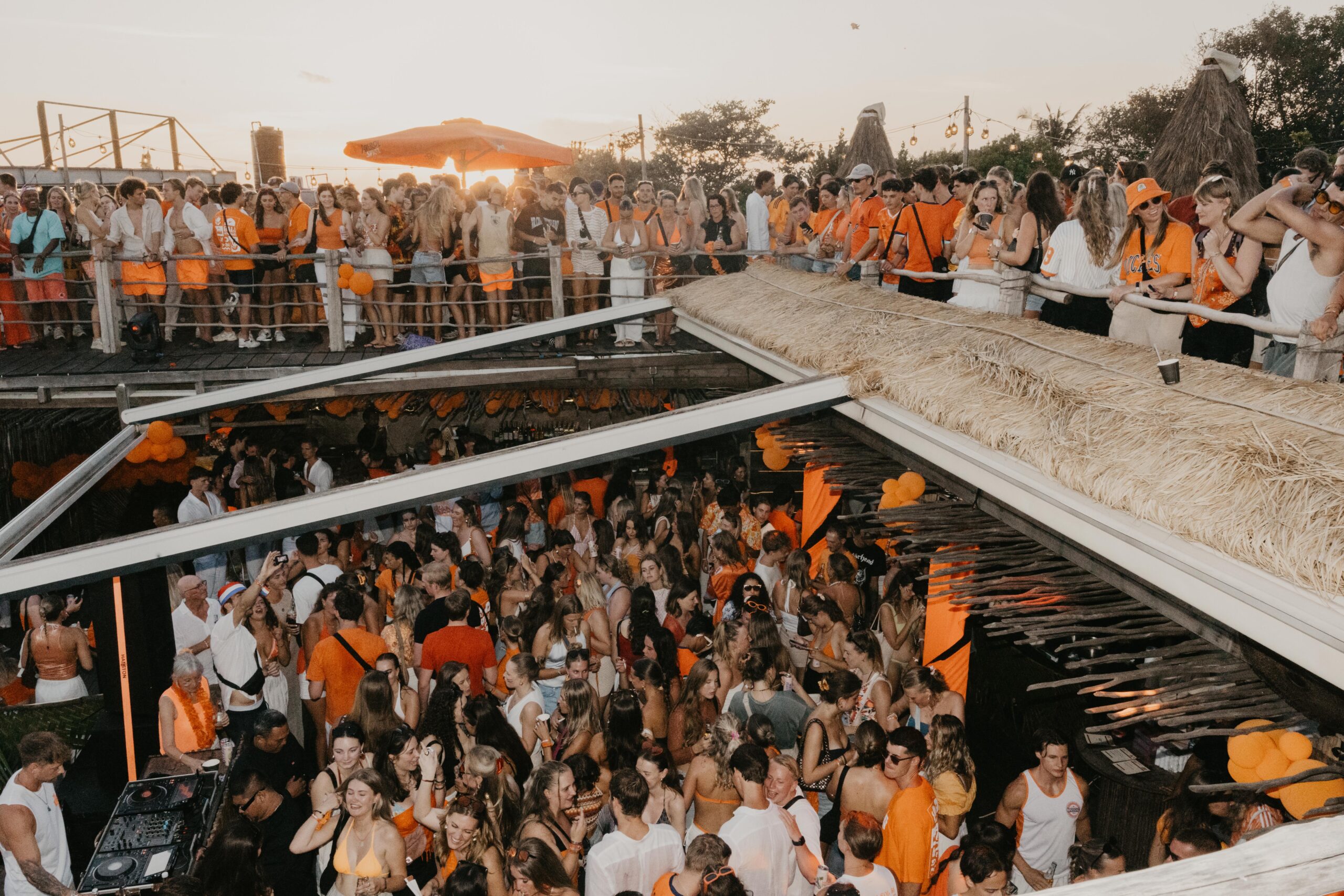 Kingsday Bali crowd in Canggu and Pererenan with rooftop party atmosphere and sunset