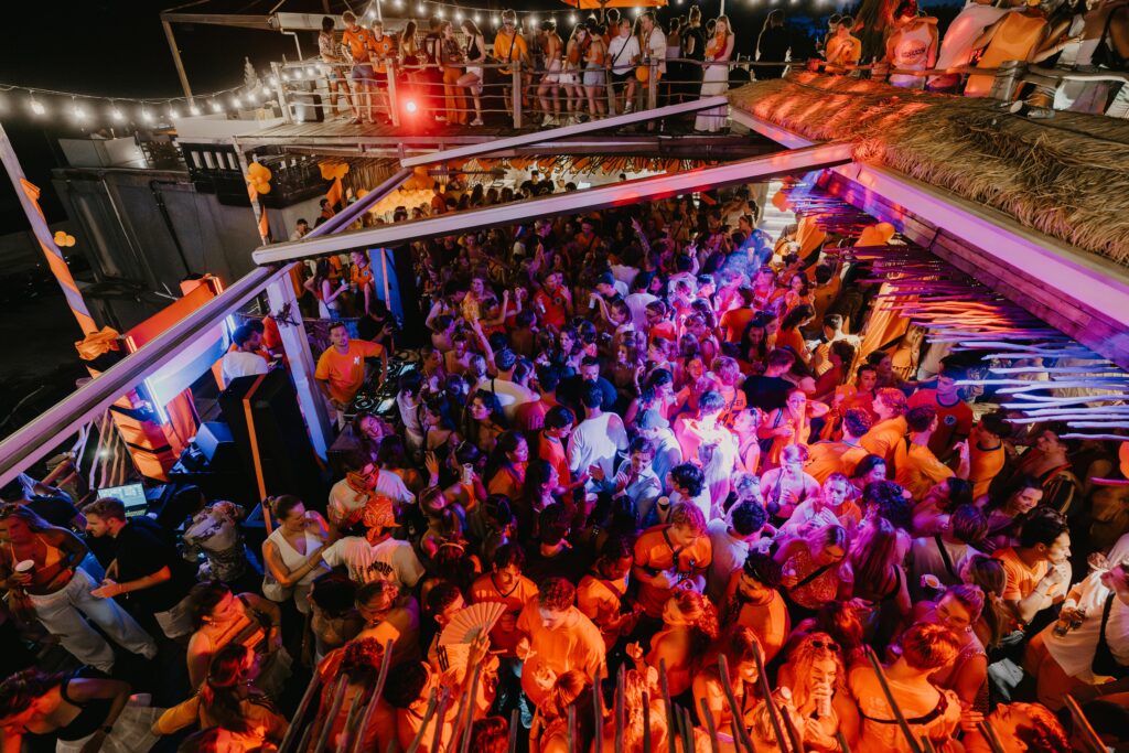 Kingsday rooftop party in Bali at Sol Rooftop Bali with crowd dancing and sunset atmosphere